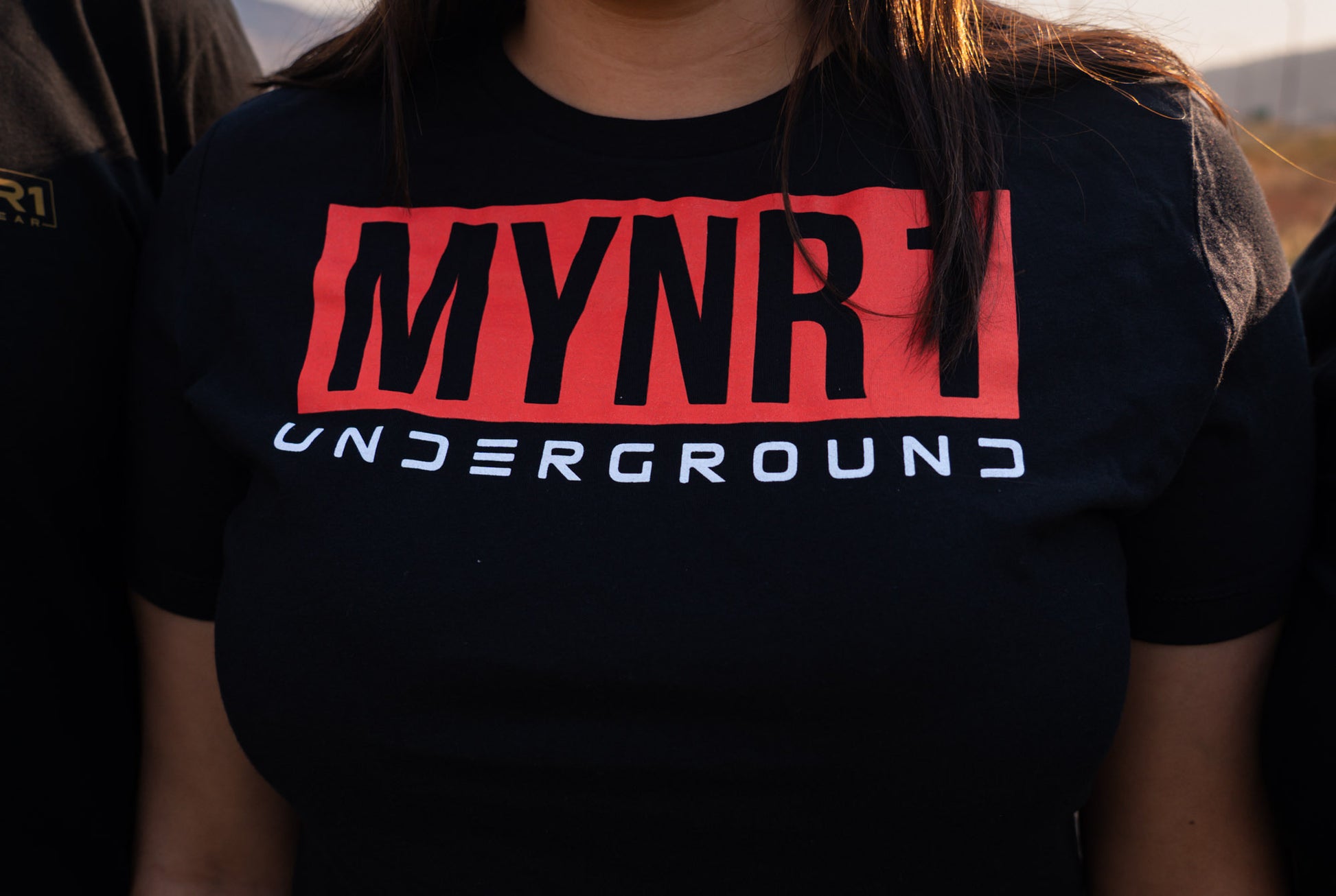 Black MYNR1 Underground with red and white text.  Unisex crewneck made from 100% Cotton and combined and ring-spun cotton.  Machine wash cold, wash inside out.  Comes in XS-XXXL